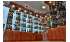 Изображение фотогаллереи №57 для раздела Хромированные стеллажи со стеклянными полками для продажи алкоголя